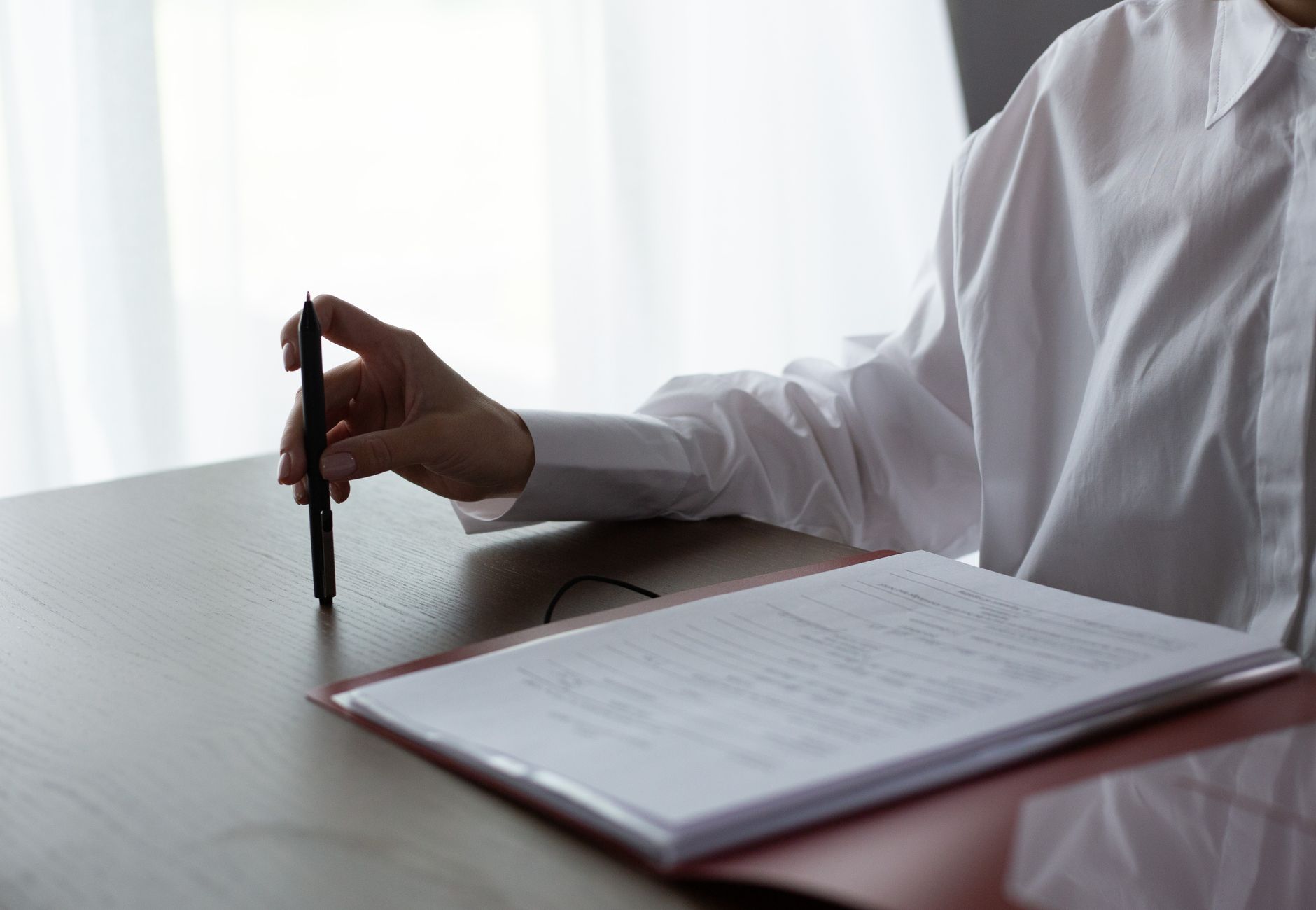 Documents and paperwork on a desk during a consultation